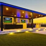 Modern covered outdoor patio with integrated lighting and bar seating