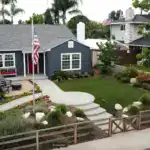 Custom outdoor living space with covered patio, fire pit, and seating area