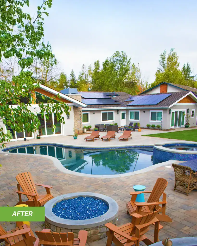 An "After" photo of a stunning backyard transformation featuring a remodeled swimming pool with vibrant blue tiles, a new stone paver patio, a custom circular fire pit with blue glass