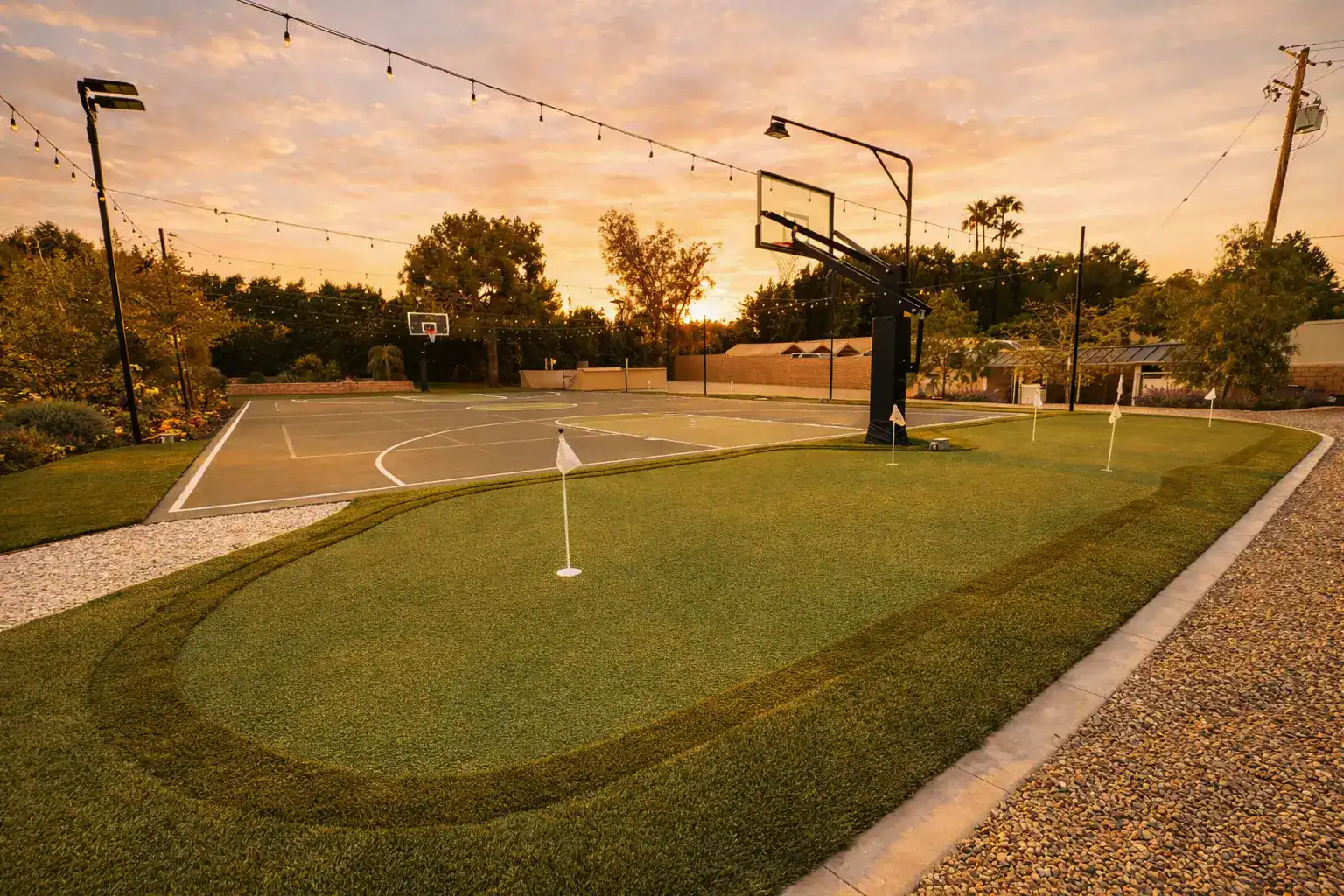 Ecoworkz backyard putting green with basketball court and outdoor recreation area