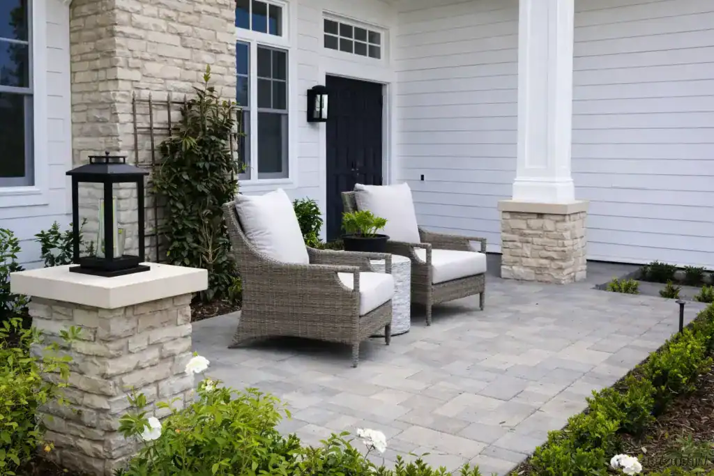 modern outdoor patio area. The patio is paved with stone tiles