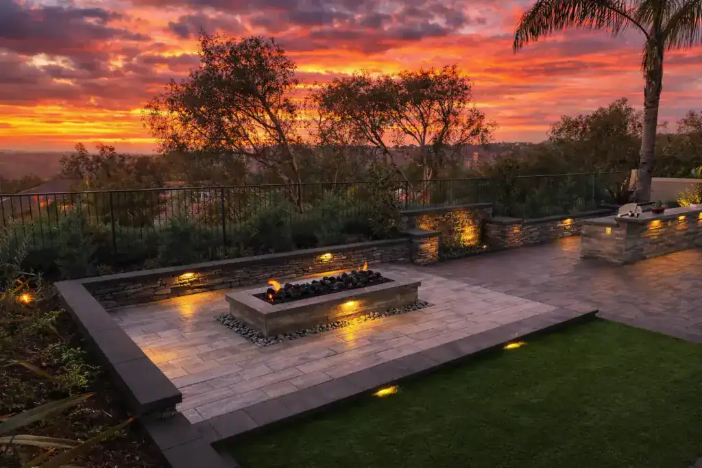 beautifully landscaped backyard at sunset