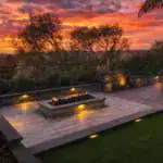 beautifully landscaped backyard at sunset